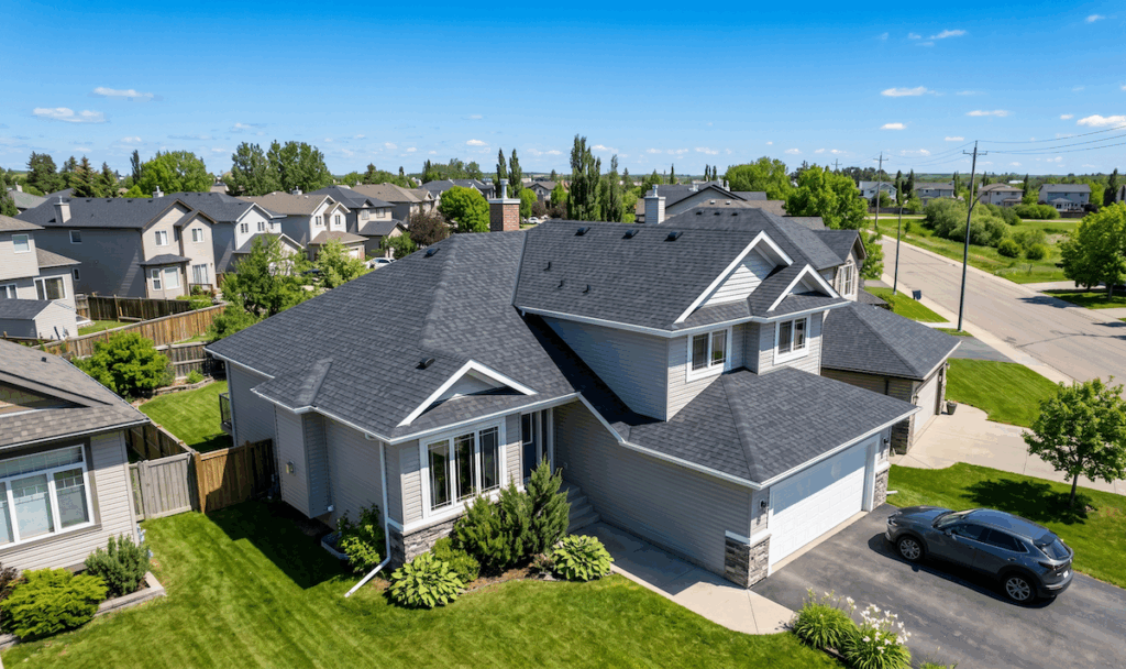 newly installed asphalt shingle roof on a suburban residential home