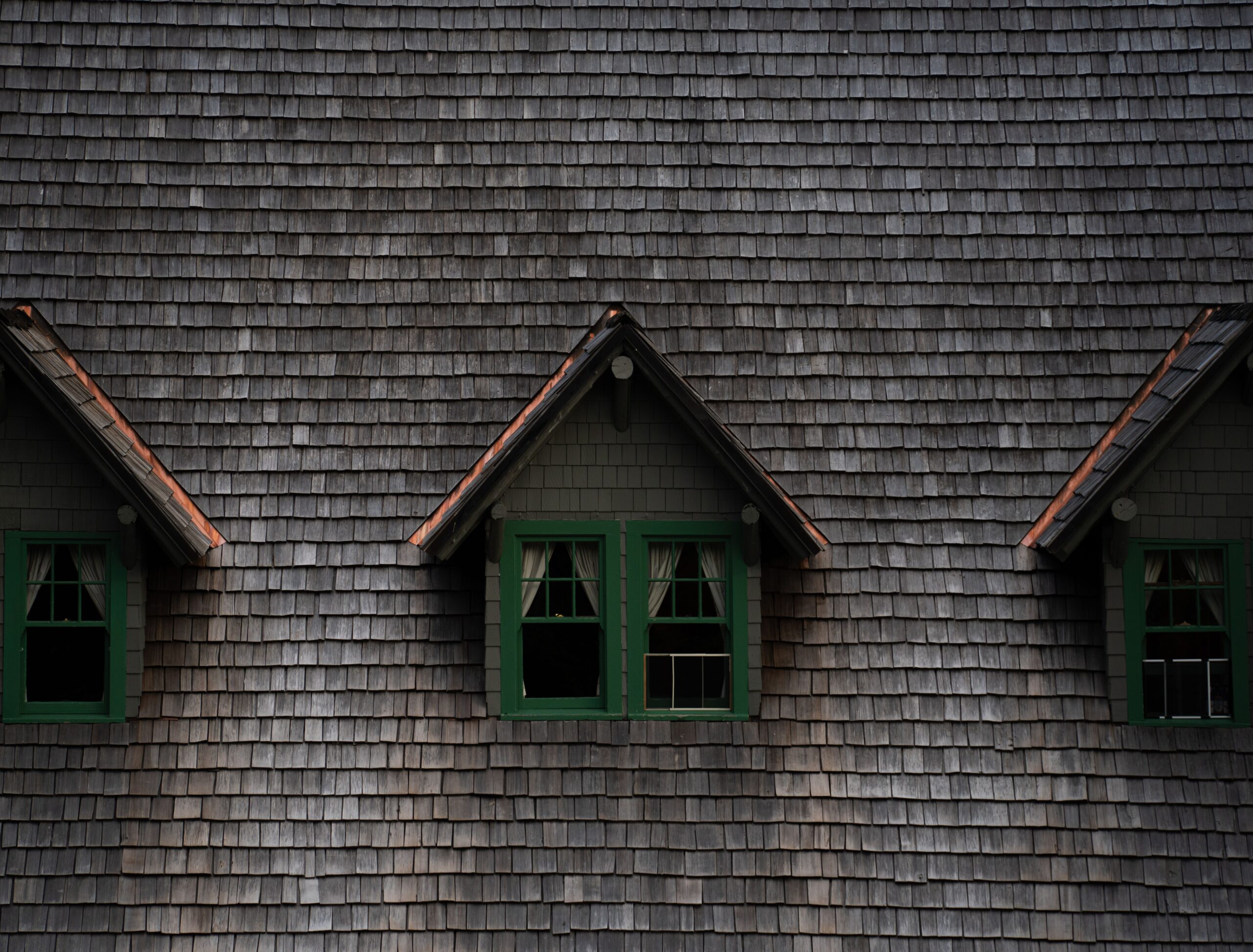Close-up of a historic building with three charming dormer windows in Washington, USA.